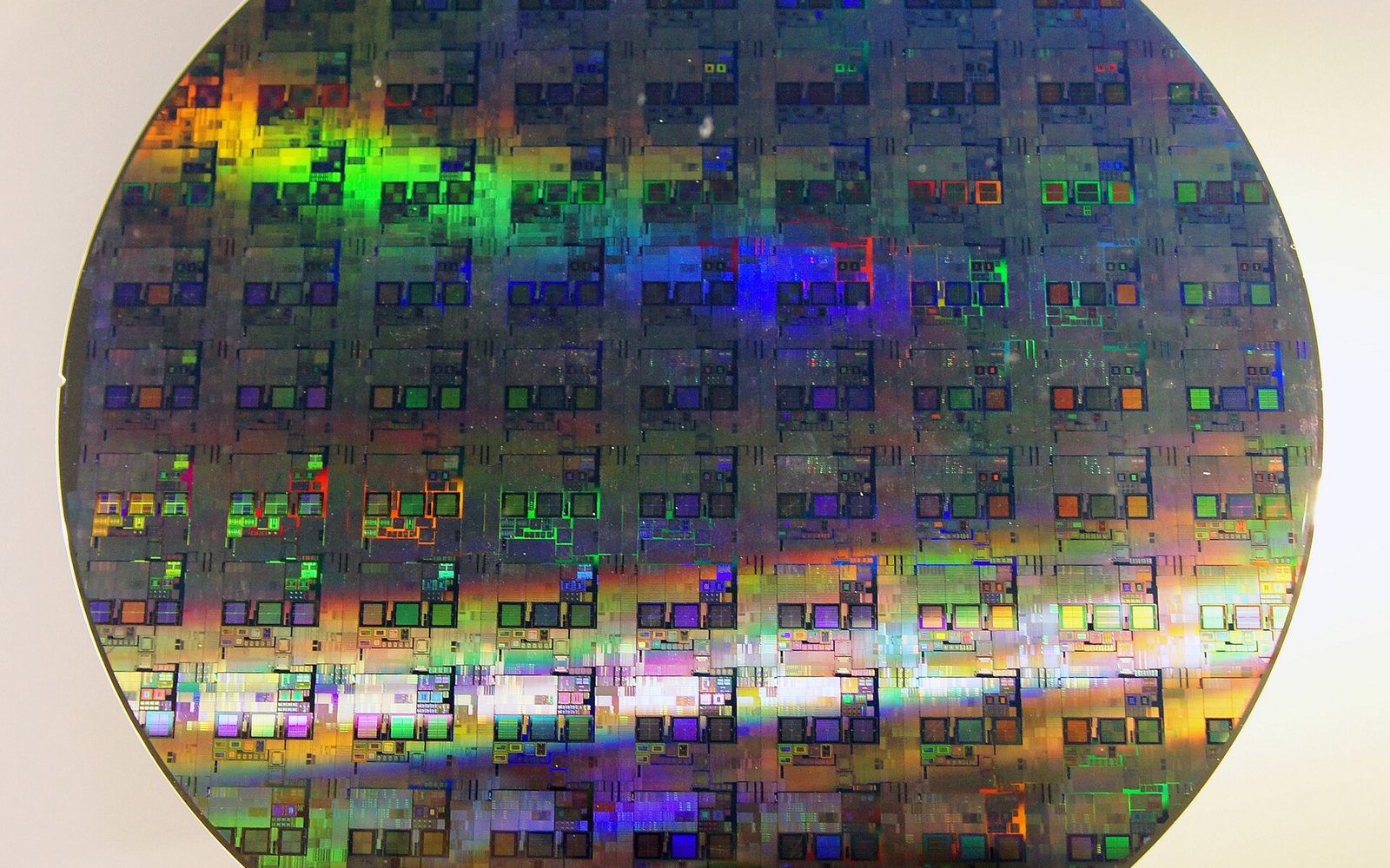 A 300 mm silicon wafer covered in a grid of microchip dies